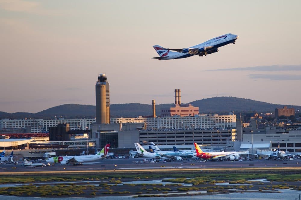 A British Airways airliner lifts off from Boston Logan International Airport. (Jesse Costa/WBUR)