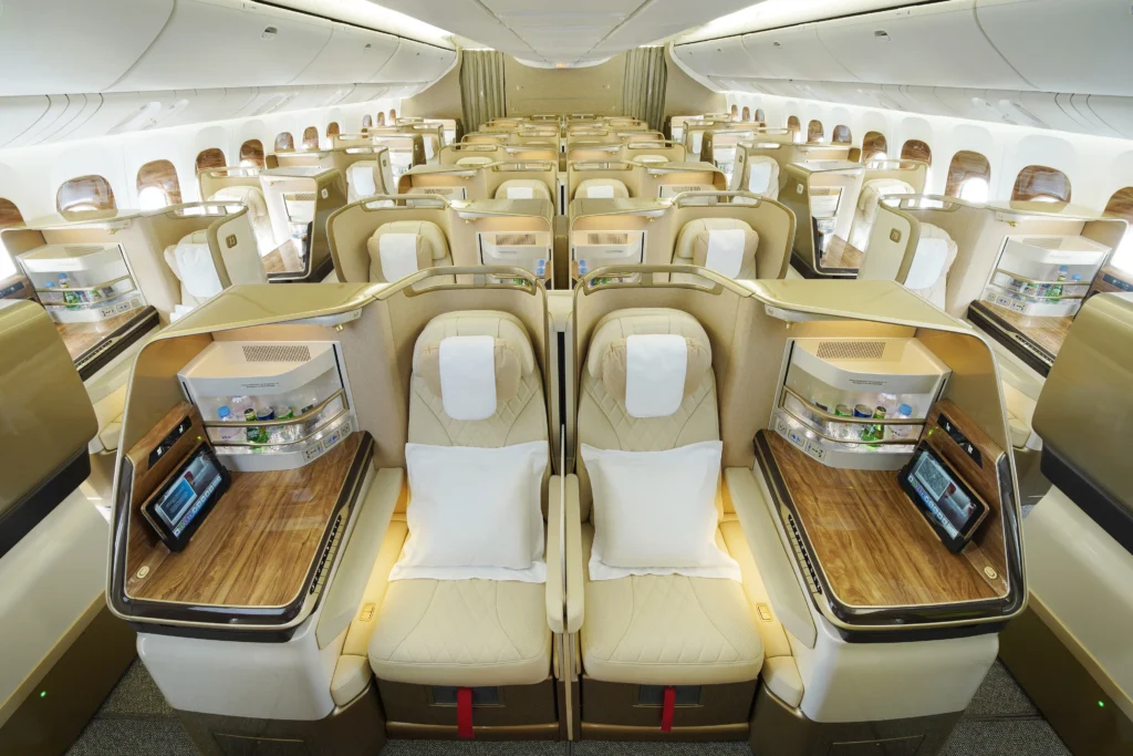 Emirates business class seat with privacy doors and lie-flat bed