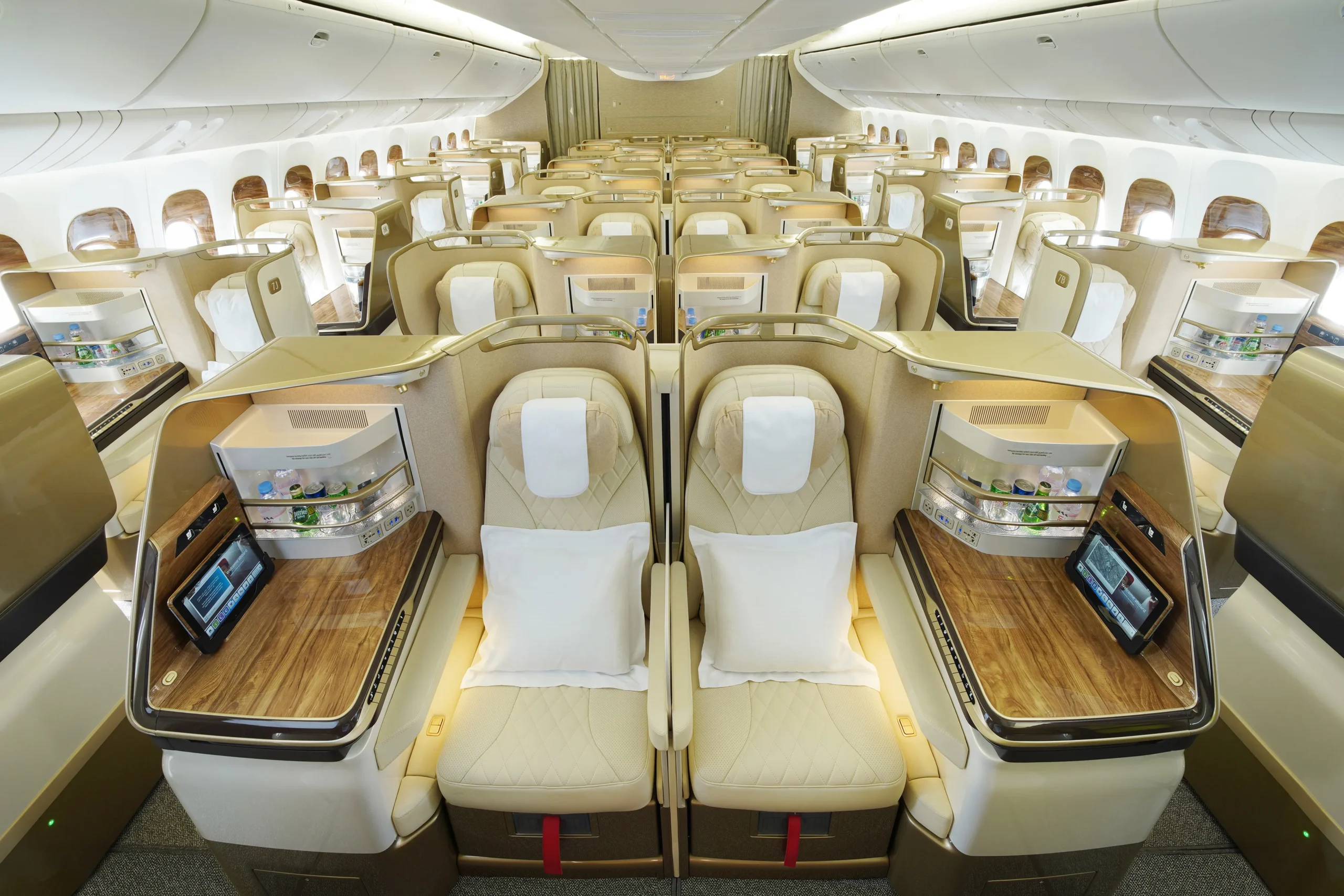 Emirates business class seat with privacy doors and lie-flat bed